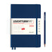 blue 2024 leuchtturm1917 daily planner with white paper banc, two blue ribbon page markers blue elastic band and pencil to right
