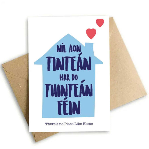 greeting card with blue house shape with navy writing inside and two pink lovehearts coming from the chimney