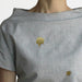 2 gold patches on a  grey linen shirt 