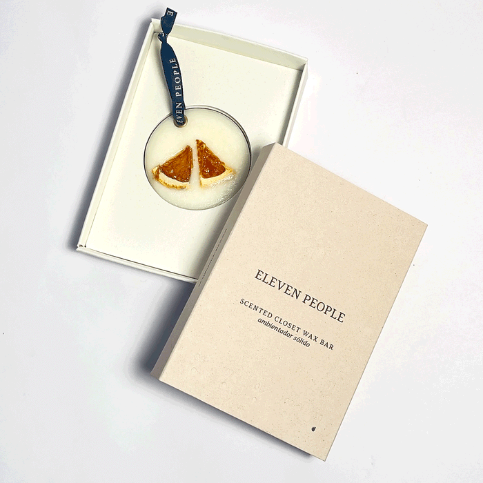 closet bar inside its packaging with front cover on top, in front of a white background