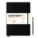 black 2024 Luechtturm 1917 week planner with white paper band, black elastic band, two black page marks and black pencils 