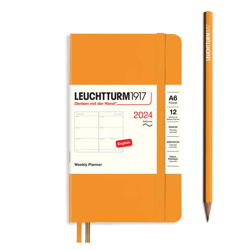 orange 2024 weekly planner white white paper wrap around, two orange ribbon page markers and orange pencil to right