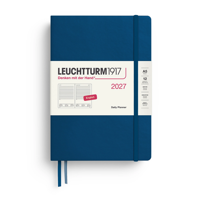 A Leuchtturm1917 2027 daily planner in navy blue with a white paper band around the middle, shown on a clean white background.