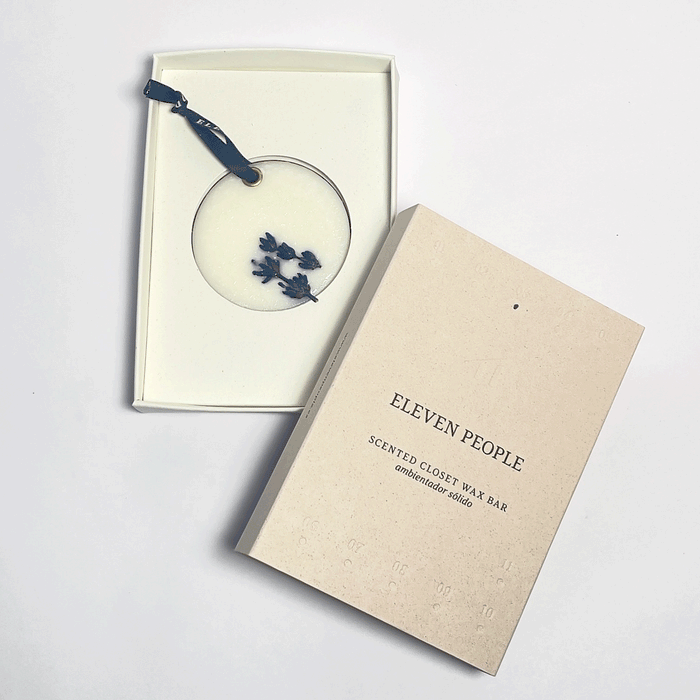 closet bar inside its packaging with front cover on top, in front of a white background