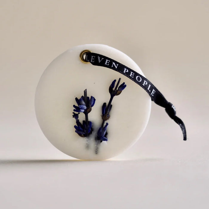 closet bar on its side, in front of an off white background