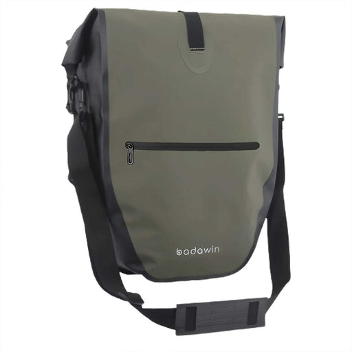 green pannier bag for bicycle with black zip pocket on front, and black strap and trim. Badawin in grey text along bottom of pannier's front