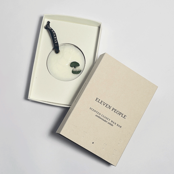 closet bar inside its packaging with front cover on top, in front of a white background