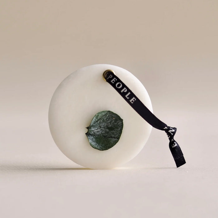 closet bar on its side, in front of an off white background