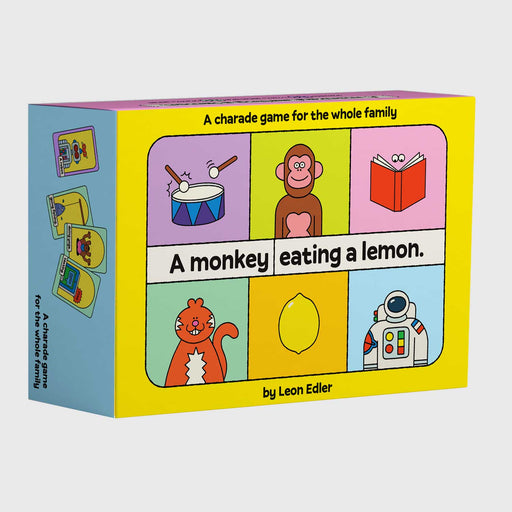 A monkey eating a lemon card game box. Yellow, with 6 cartoon images of various objects on the front
