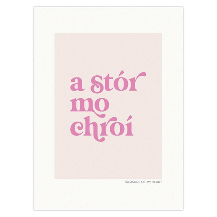 light pink print with white boarder and dark pin text in the centre which reads A Stór Mo Chroí