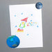 a child's crayon drawing of a rocket and stars being fixed to a metal surface by a magnet of the earth and magnet of the moon