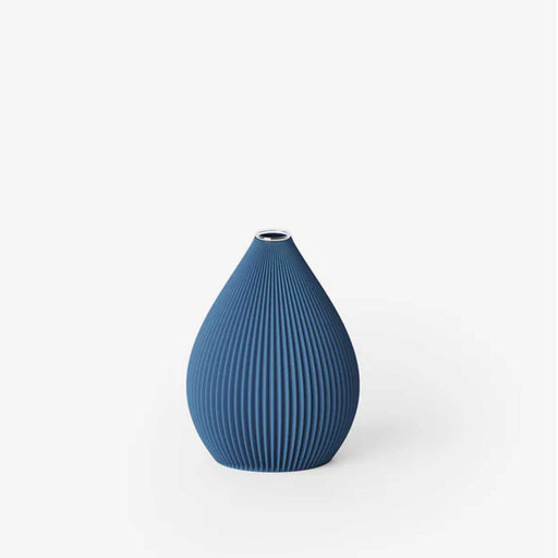 blue oval balloon shaped ridged vase with glass vial insert