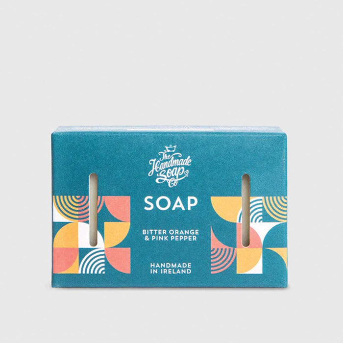bue soap bar box with The Handmade Soap Co in scriptive text on front and Soap in white capital letters underneath. Box also has a pink and orange semicirlce pattern on left and right of front of box.