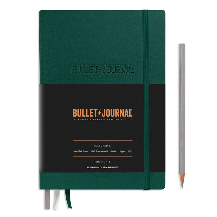 green bullet journal notebook with black paper wrap band, green elastic closure and 3 ribbon page markers
