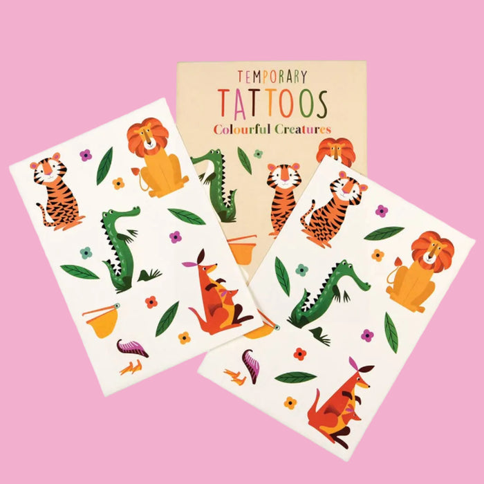 Set of temporary tattoos with colorful animal designs on a white background