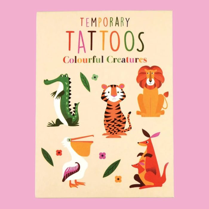 Packaging of temporary tattoos with colorful animal illustrations on a beige background