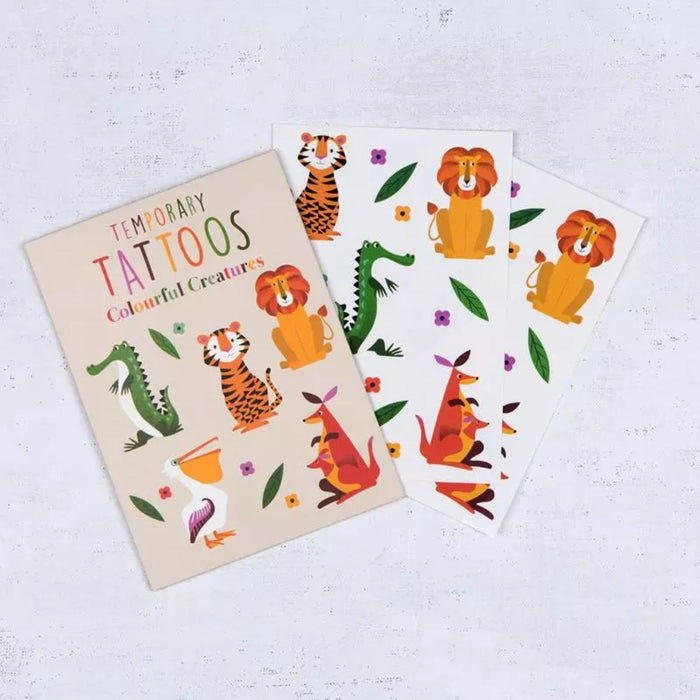 Set of temporary tattoos with colorful animal designs on a white background