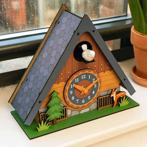 cuckoo clock with triangle roof and white cuckoo bird