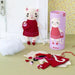 Plush cat toy with a dress and accessories next to a cylindrical packaging labeled 'Kitty'.