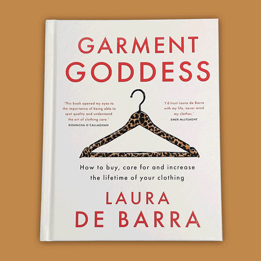 Garment Goddess book with leopard print hanger on the front , on top of a light brown background