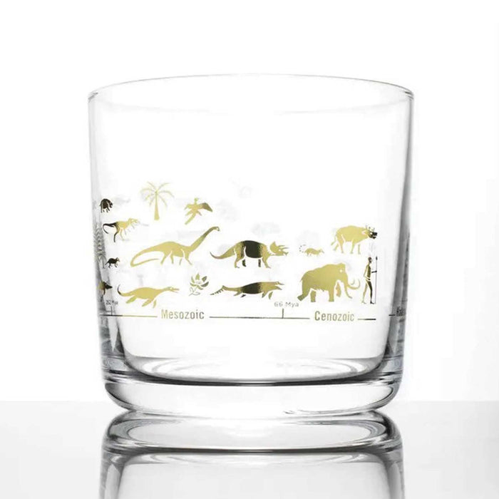 whiskey glass with two rows of golden dinosaurs, mammoths and man on the outside