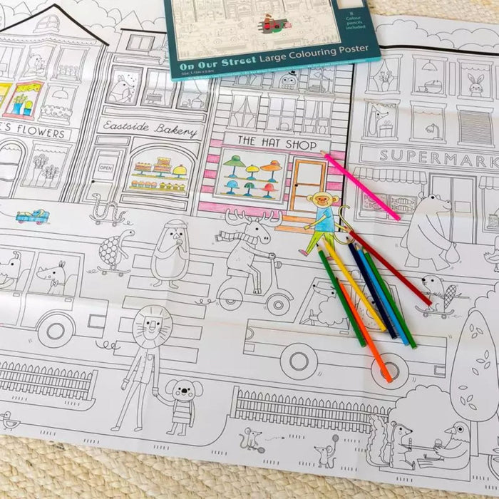 Coloring poster with a street scene and colored pencils on a textured surface