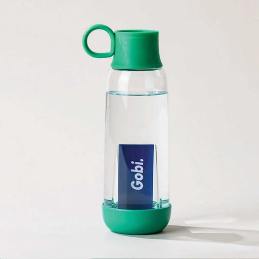 clear water bottle with green base and cap that has a round green holder attached. A blue gobi cardboard tag can be seen in centre of bottle
