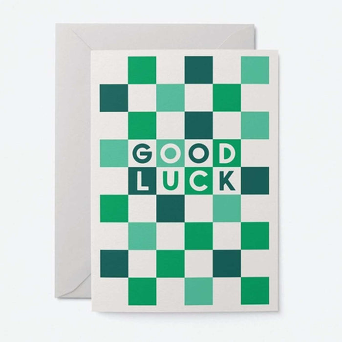 white card with green checkered square and Good Luck on front
