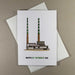 white greeting card with low building with two long thin chimney towers that are painted with 
green and white stripe