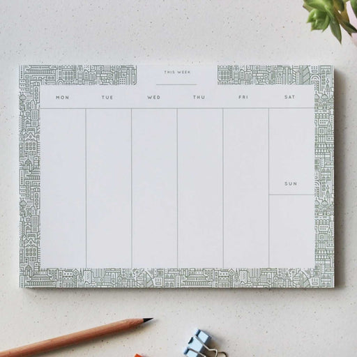 WEEKLY PLANNER PAD WITHSEVEN COLUMNS AND ILLUSTRATED BORDER.