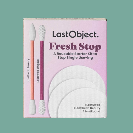 pink LastObject Fresh Stop box with image of 2 swabs on front left with 3 cotton rounds to bottom right of box. Against a sea foam green backdrop