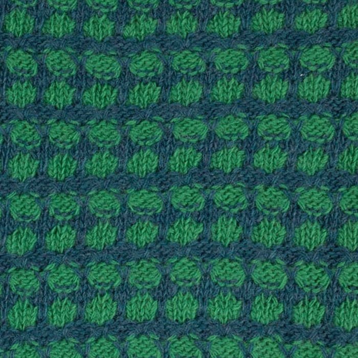 Patterned knitted fabric with green and blue design