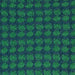 Patterned knitted fabric with green and blue design