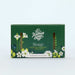 lavender soap packaged in a green box with floral pattern
