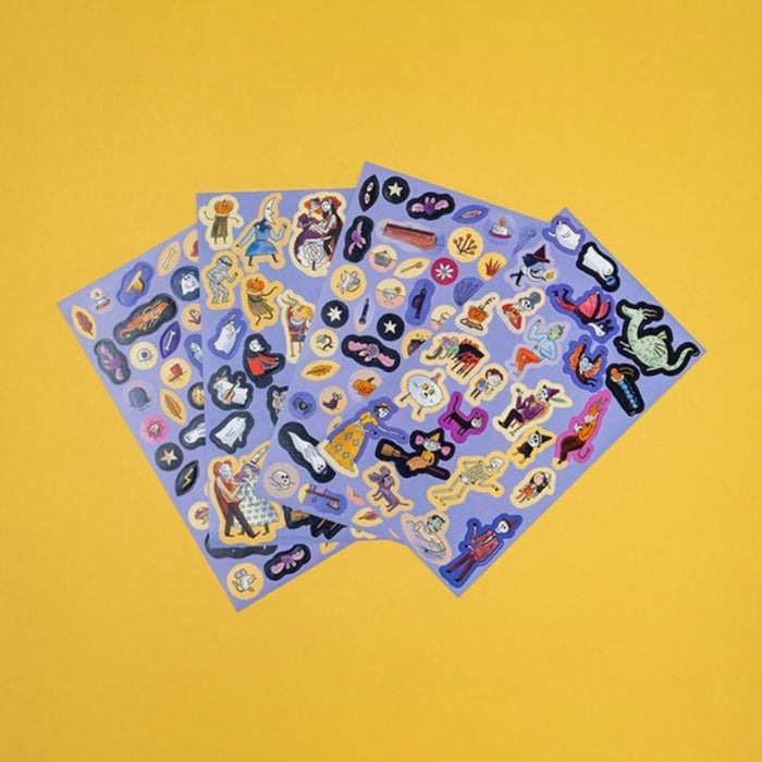 Two sheets of colorful stickers on a yellow background