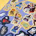 Collection of colorful Halloween-themed stickers on a purple background