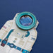 Close-up of a paper craft astronaut model with a kaleidoscopic window in his helmet on a blue background