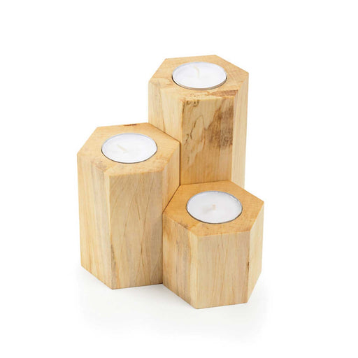 3 hexagonal wooden tealight holders, in 3 different sizes each holding a tealight