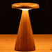 Mini Sylva table lamp. A conical dark walnut wood lamp, with flat wooden top  which is illuminated from below