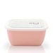 pink ceramic container with opaque plastic lid
