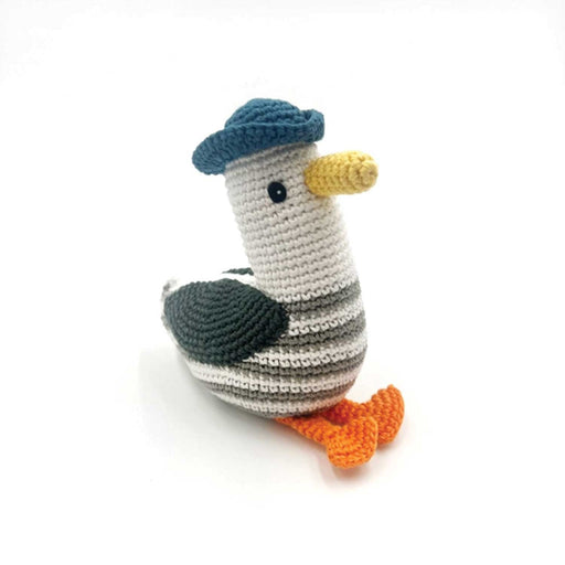 crocheted seagull toy with blue hat, yellow beak grey and white strip body and orange legs