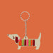 Keychain in the shape of a dachshund with a colorful striped pattern on a white background