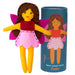 Felt fairy doll with brown hair, red shirt, pink skirt, and yellow arms and legs, next to a blue tube packaging with illustrations and text.