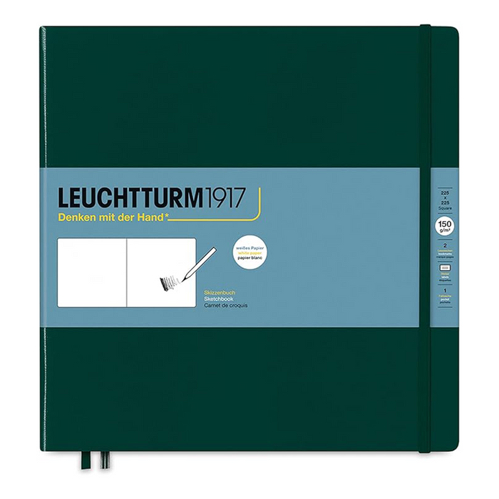 Leuchtturm1917 notebook in dark forest green with a light blue front cover label, shown closed on a white background.