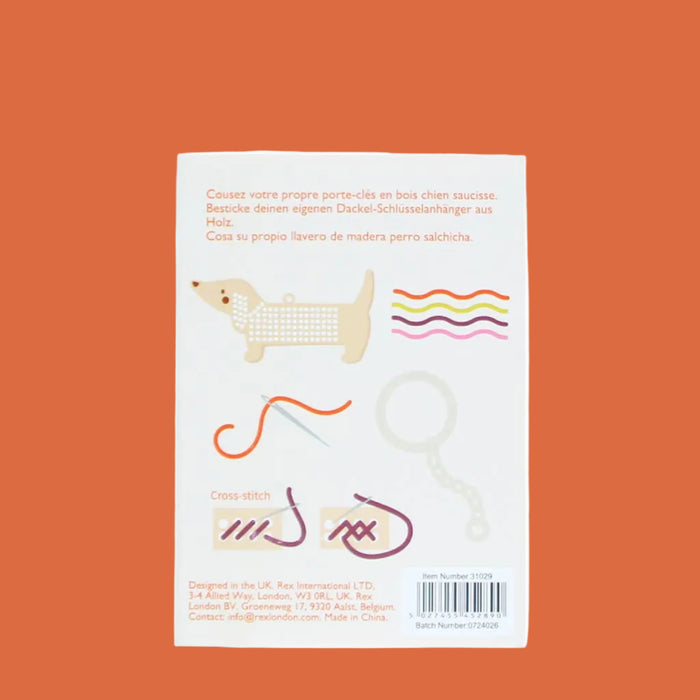 Product packaging with illustrations of a dog and a key on a white background