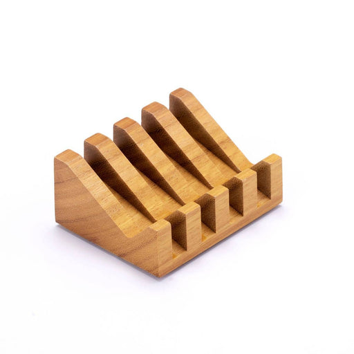 Wooden knife block with multiple slots on a white background