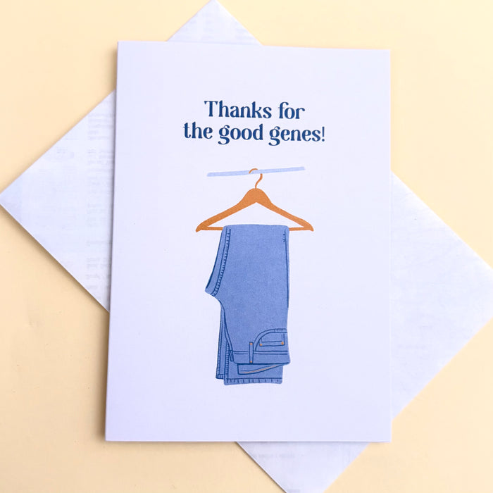 Thanks for the Good Genes greeting card, white card with image of a hanger holding a pair of blue denim jeans