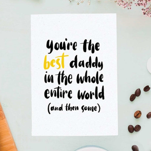 daddy white card with black text and best in gold text with blue background