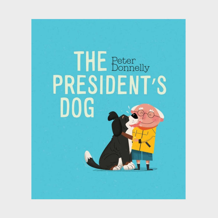 The Presidents Dog book. blue cover with white text and a black and white cartoon dog liicking a grey haired mans face