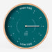 Teal coloured tide clock against a white background.